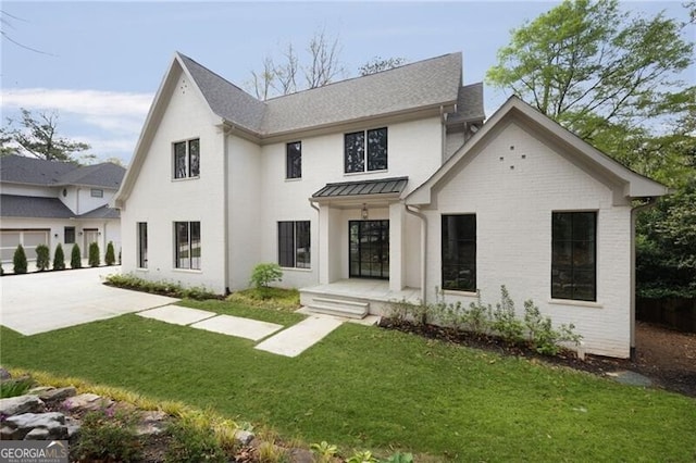 1074 Moores Mill Rd NW, Atlanta, GA 30327 - modern farmhouse with a front yard, a standing seam roof, and a shingled roof