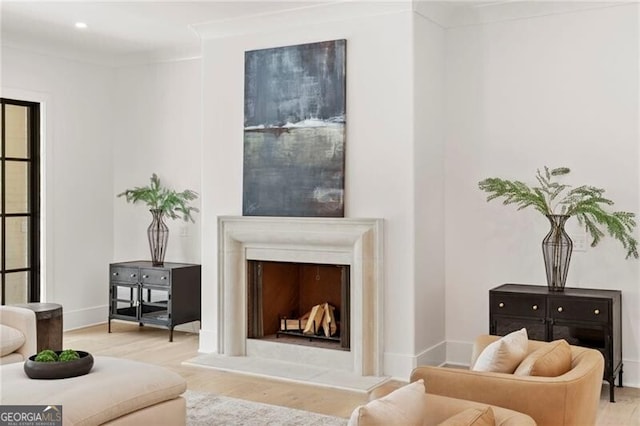 1074 Moores Mill Rd NW, Atlanta, GA 30327 - living room featuring wood finished floors, a fireplace with raised hearth, and recessed lighting
