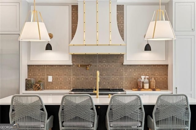 1074 Moores Mill Rd NW, Atlanta, GA 30327 - kitchen featuring light countertops, white cabinets, and tasteful backsplash