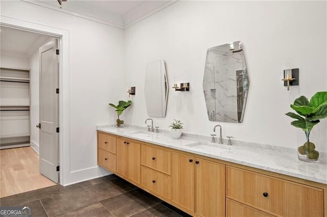1074 Moores Mill Rd NW, Atlanta, GA 30327 - bathroom with double vanity, a marble finish shower, and ornamental molding