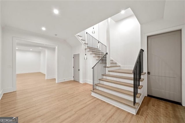 1074 Moores Mill Rd NW, Atlanta, GA 30327 - staircase with wood finished floors and recessed lighting