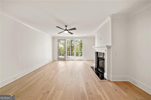 1074 Moores Mill Rd NW, Atlanta, GA 30327 - unfurnished living room featuring ceiling fan, a fireplace, light wood-style flooring, and ornamental molding