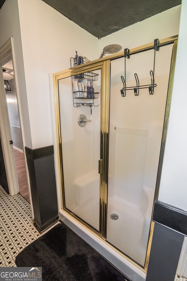 full bathroom with a shower stall
