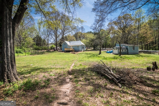 view of yard with a shed and an outdoor structure