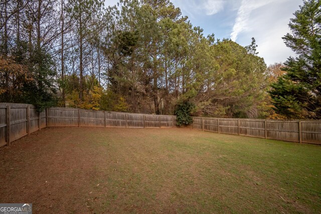 view of yard with a fenced backyard