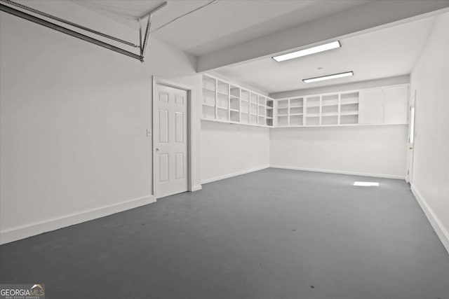 garage featuring baseboards