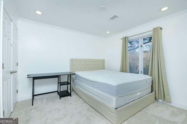 carpeted bedroom featuring recessed lighting, ornamental molding, baseboards, and visible vents