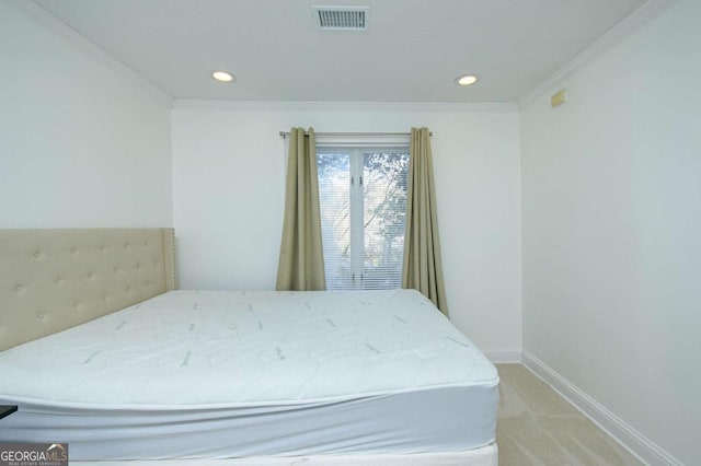 bedroom with recessed lighting, ornamental molding, baseboards, visible vents, and light carpet