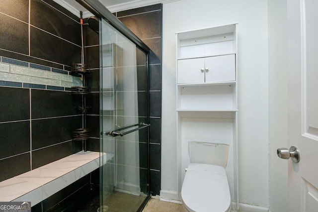 bathroom featuring a shower stall and toilet