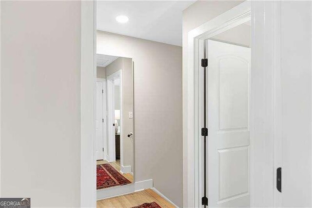 hallway with light wood-type flooring