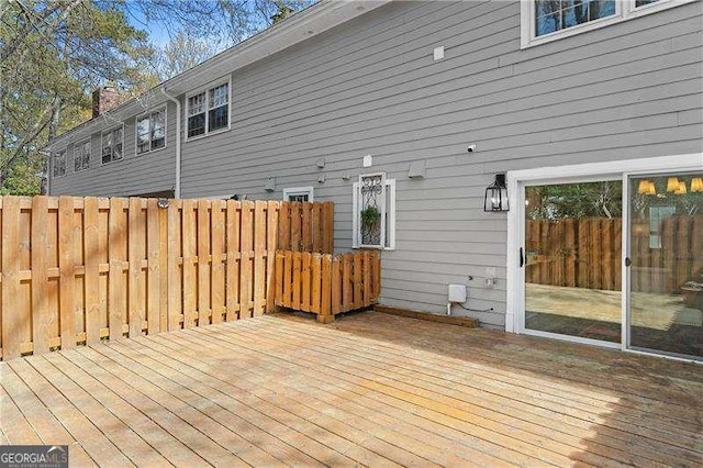 wooden deck featuring fence
