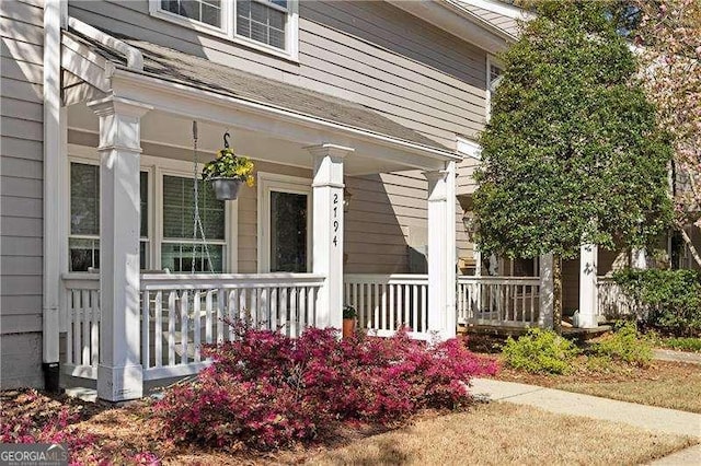 doorway to property featuring covered porch