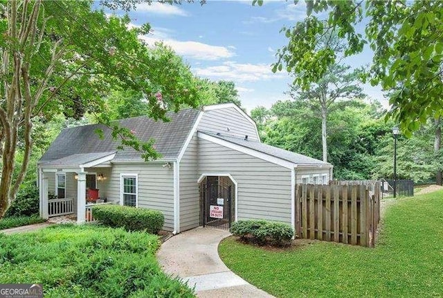view of outbuilding with fence