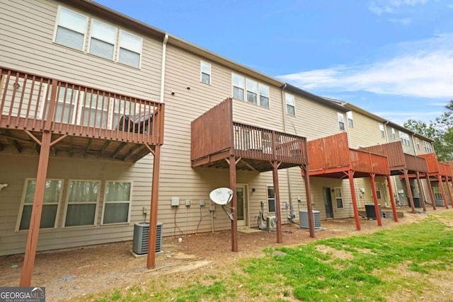 back of property featuring central AC and a wooden deck