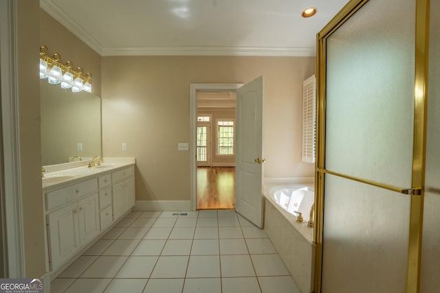 full bathroom with a bath, crown molding, tile patterned floors, and a sink