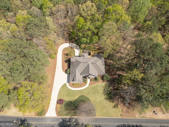 aerial view featuring a wooded view