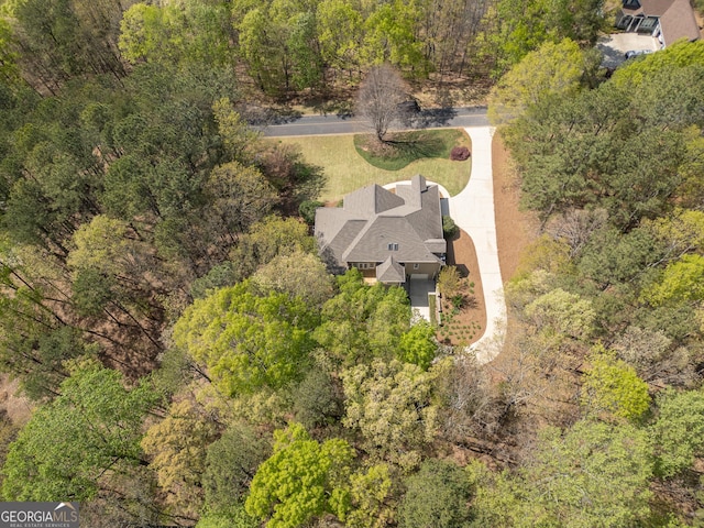 drone / aerial view with a view of trees
