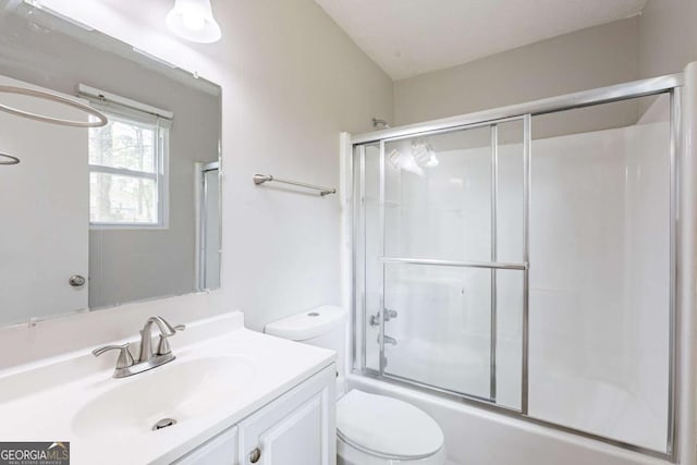 full bath with toilet, enclosed tub / shower combo, and vanity