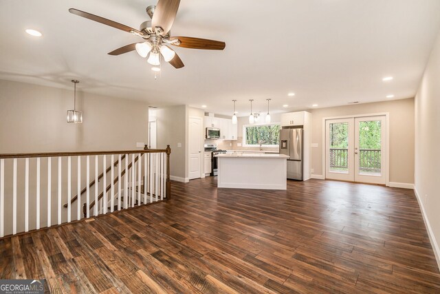2183 Seaman Cir, Atlanta, GA 30341 - unfurnished living room featuring dark wood-type flooring, a healthy amount of sunlight, and recessed lighting
