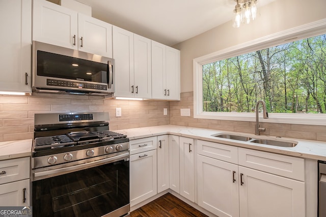 2183 Seaman Cir, Atlanta, GA 30341 - kitchen with a sink, a wealth of natural light, backsplash, and appliances with stainless steel finishes