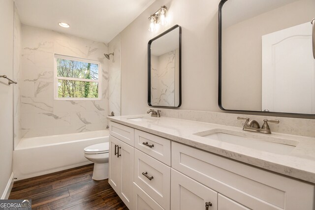 2183 Seaman Cir, Atlanta, GA 30341 - bathroom with toilet, wood finished floors, double vanity, and a sink