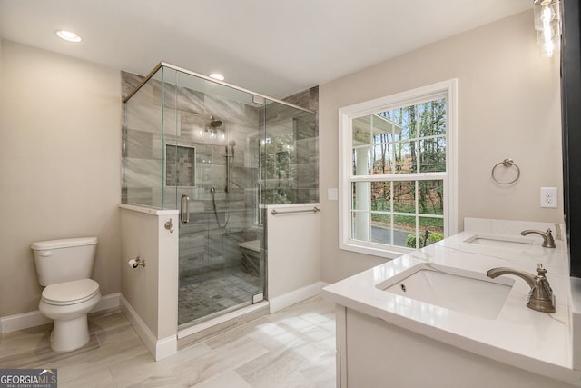 2183 Seaman Cir, Atlanta, GA 30341 - full bath featuring toilet, a sink, a stall shower, and double vanity