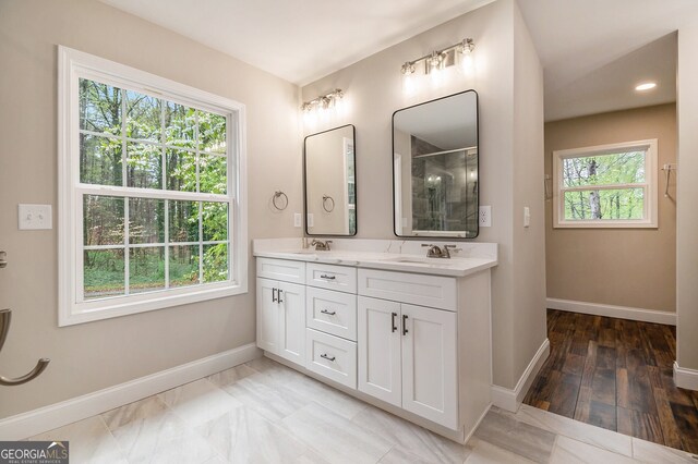 2183 Seaman Cir, Atlanta, GA 30341 - full bathroom with a shower with door, baseboards, double vanity, and a sink