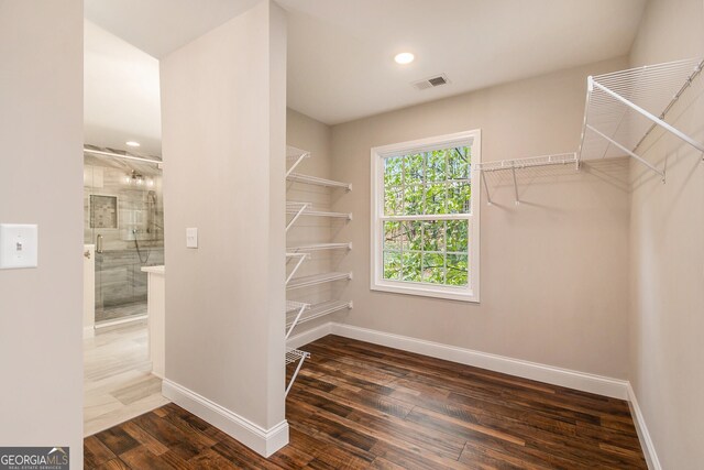 2183 Seaman Cir, Atlanta, GA 30341 - walk in closet featuring wood finished floors and visible vents