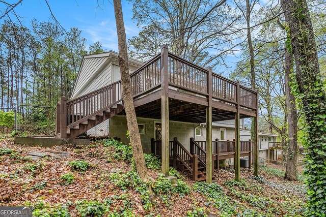 2183 Seaman Cir, Atlanta, GA 30341 - rear view of property with stairs, fence, cooling unit, and a deck