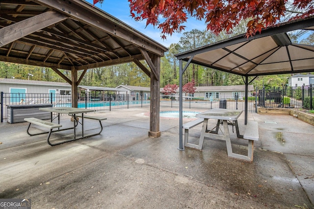 2183 Seaman Cir, Atlanta, GA 30341 - view of patio / terrace with fence, a gazebo, and a community pool