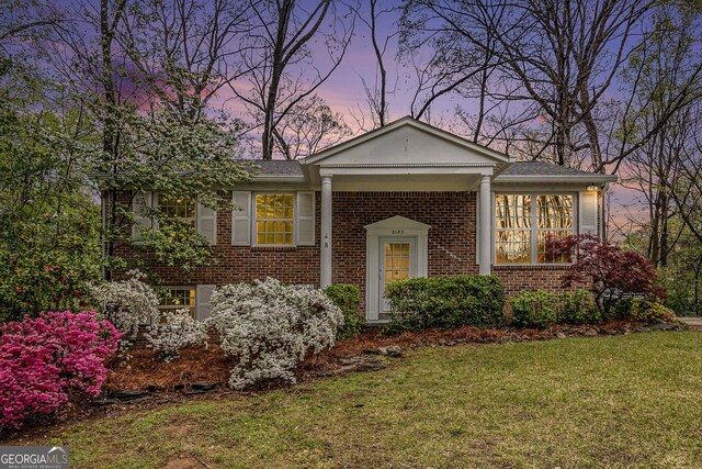 2183 Seaman Cir, Atlanta, GA 30341 - view of front of property featuring brick siding and a yard
