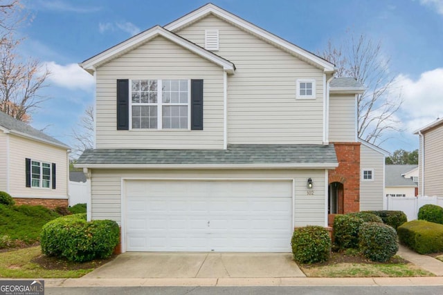 102 Manley Ct, Woodstock, GA 30188 - traditional home with a garage, concrete driveway, and roof with shingles