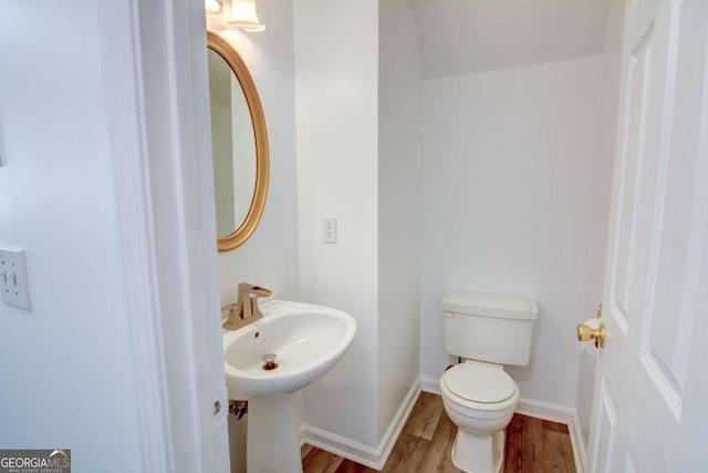 102 Manley Ct, Woodstock, GA 30188 - half bath with wood finished floors, toilet, baseboards, and a sink