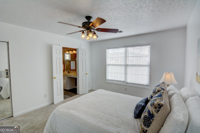 102 Manley Ct, Woodstock, GA 30188 - bedroom featuring carpet flooring, baseboards, ceiling fan, and connected bathroom