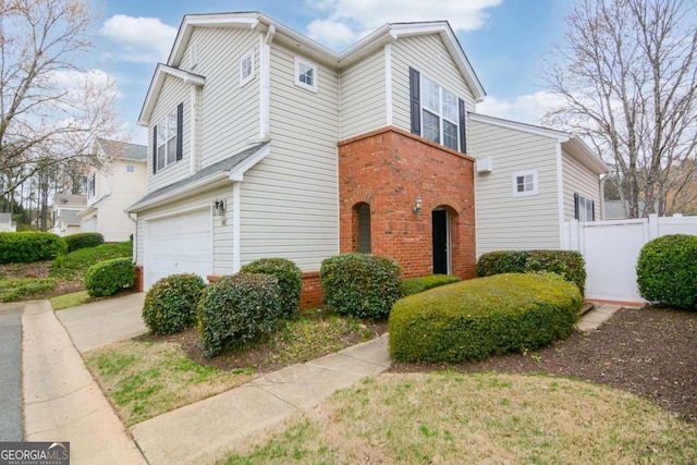102 Manley Ct, Woodstock, GA 30188 - view of front of house featuring brick siding, a garage, and driveway