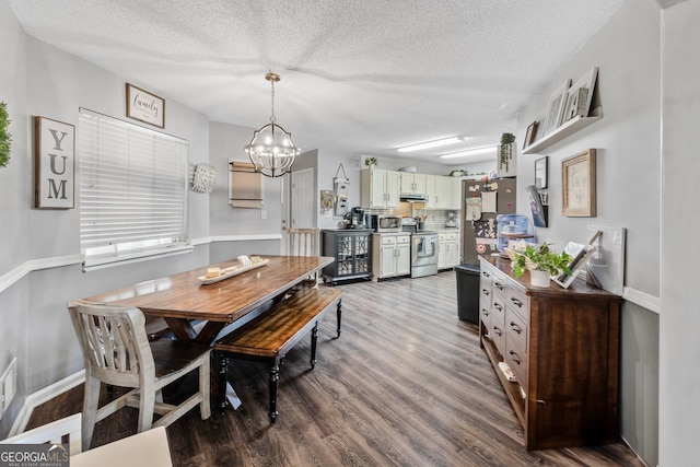 95 Joshua Ct, Zebulon, GA 30295 - dining area with a chandelier, wood finished floors, and a textured ceiling