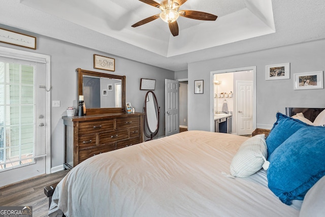 95 Joshua Ct, Zebulon, GA 30295 - bedroom featuring a tray ceiling, wood finished floors, multiple windows, and ceiling fan