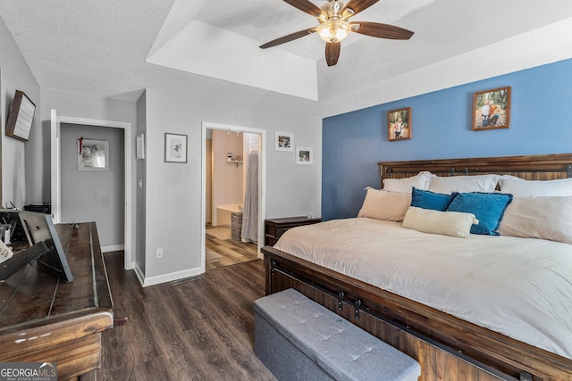 95 Joshua Ct, Zebulon, GA 30295 - bedroom featuring a raised ceiling, wood finished floors, a textured ceiling, ensuite bath, and ceiling fan