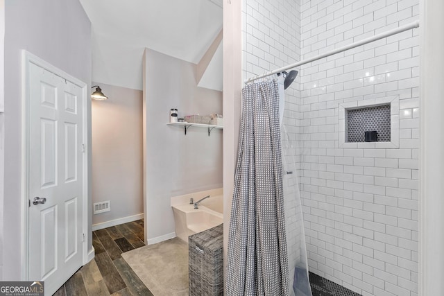 95 Joshua Ct, Zebulon, GA 30295 - full bath with a bath, tiled shower, and wood finished floors