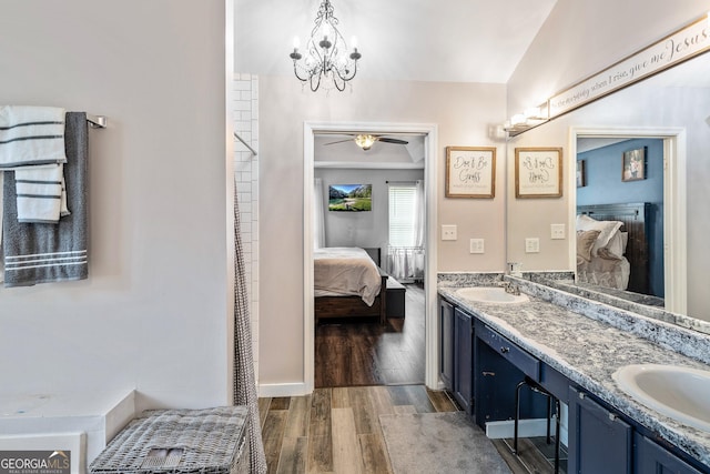 95 Joshua Ct, Zebulon, GA 30295 - bathroom with ensuite bathroom, double vanity, wood finished floors, ceiling fan, and a chandelier