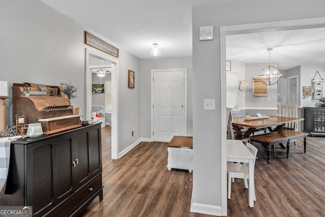 95 Joshua Ct, Zebulon, GA 30295 - foyer with dark wood finished floors, a textured ceiling, and a chandelier