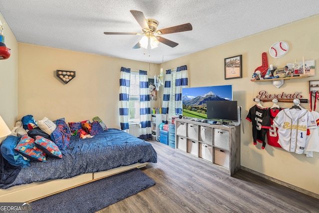 95 Joshua Ct, Zebulon, GA 30295 - bedroom featuring wood finished floors, a textured ceiling, and ceiling fan