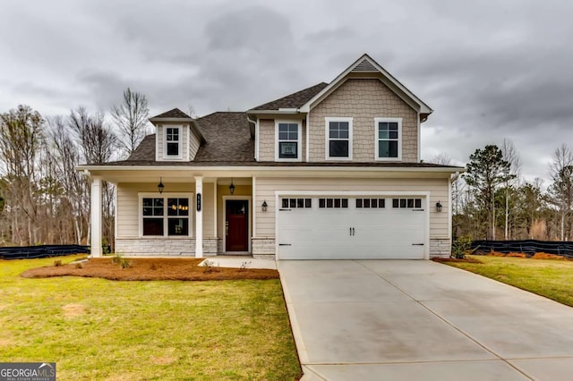 497 Principal Meridian Dr, Dallas, GA 30132 - craftsman-style house with a porch, a front lawn, concrete driveway, an attached garage, and stone siding