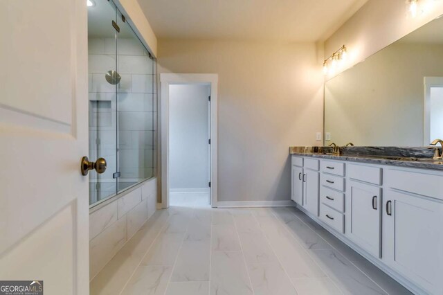 497 Principal Meridian Dr, Dallas, GA 30132 - full bath featuring double vanity, tiled shower, marble finish floors, and baseboards