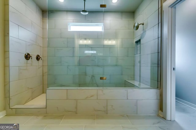 497 Principal Meridian Dr, Dallas, GA 30132 - bathroom with a tile shower, marble finish floors, recessed lighting, and baseboards