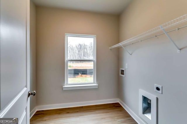 497 Principal Meridian Dr, Dallas, GA 30132 - laundry room with hookup for an electric dryer, wood finished floors, and baseboards