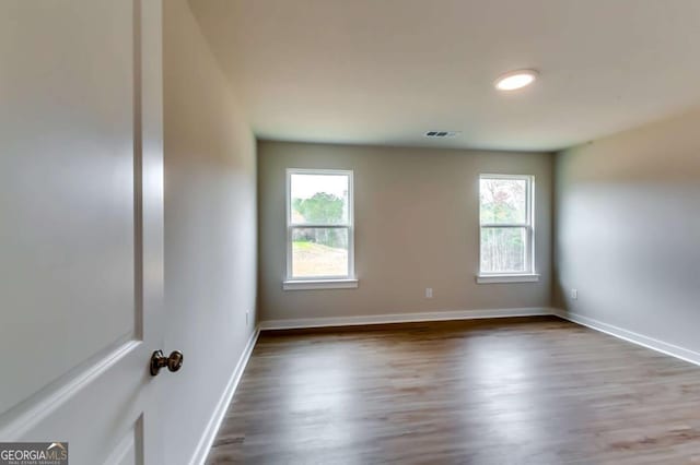 497 Principal Meridian Dr, Dallas, GA 30132 - unfurnished room with healthy amount of natural light, wood finished floors, and baseboards