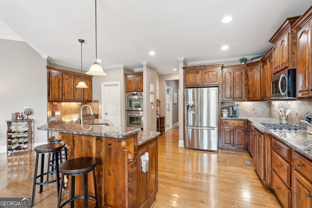 968 Woodtrace Ln, Auburn, GA 30011 - kitchen featuring ornamental molding, a kitchen bar, decorative backsplash, stainless steel appliances, and a sink
