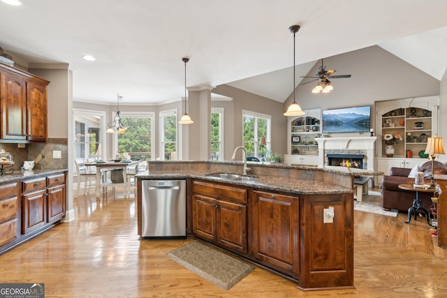 968 Woodtrace Ln, Auburn, GA 30011 - kitchen with a lit fireplace, a ceiling fan, light wood-style floors, dishwasher, and a sink