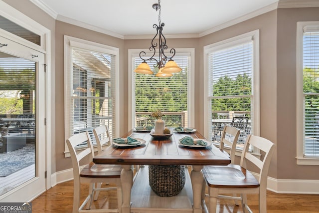968 Woodtrace Ln, Auburn, GA 30011 - dining area with wood finished floors, an inviting chandelier, and a healthy amount of sunlight